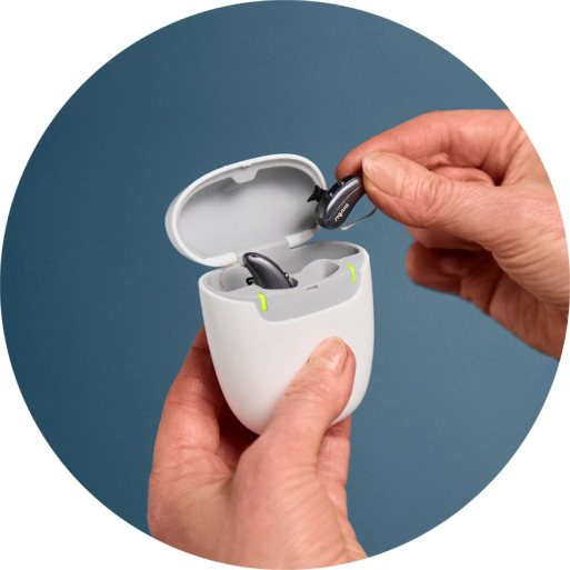 Pure-Charge-Go-IX_lab_hearing-aids-into-charger_circle_1000x1000-1